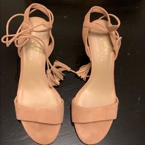 Neutral shoes with ties.